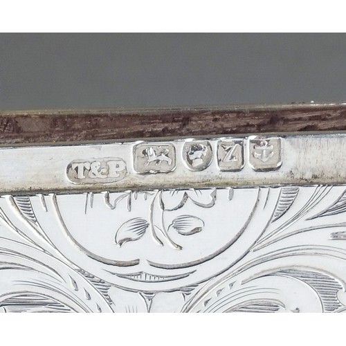 185 - An early Victorian silver card case holder, wavy side the entire profusely engraved with foliate scr... 