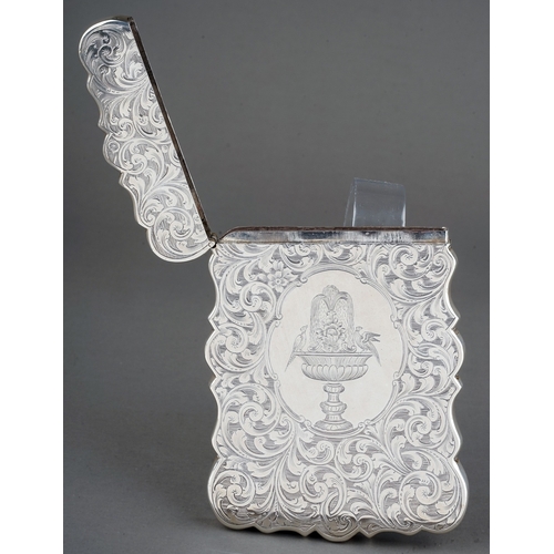 185 - An early Victorian silver card case holder, wavy side the entire profusely engraved with foliate scr... 