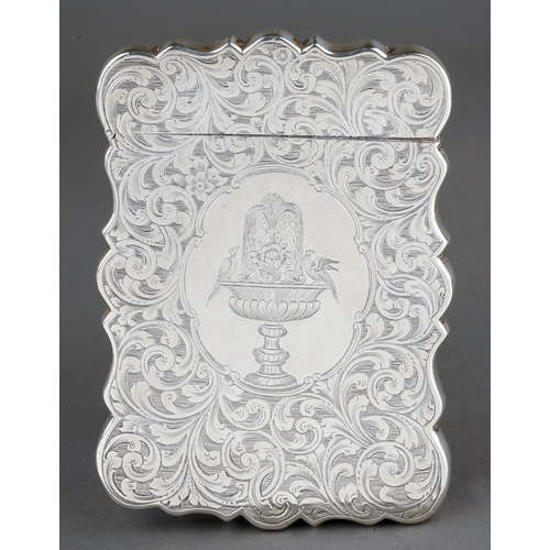 185 - An early Victorian silver card case holder, wavy side the entire profusely engraved with foliate scr... 