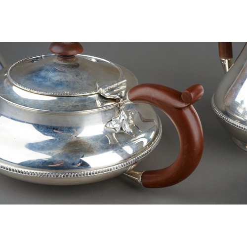 187 - A George V silver four piece tea service comprising teapot, sugar bowl, milk jug and hotwater jug, p... 