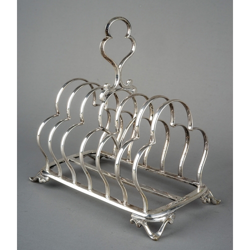 188 - A George III silver plated  large seven bar toast rack with loop handle on four openwork triangular ... 