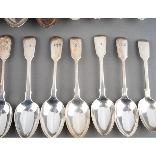 200 - A collection of 19th Century silver fiddle pattern flatware mainly teaspoons with two dessert spoons... 