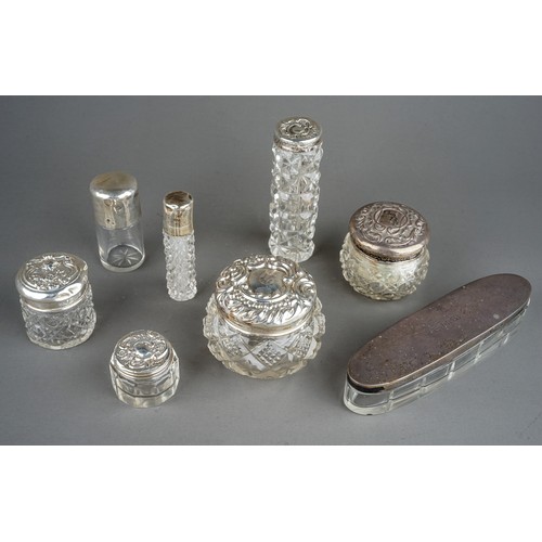 204 - A collection of six early 20th Century silver mounted dressing table jars and two silver mounted sce... 