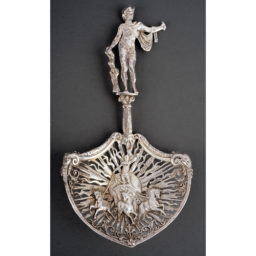 205 - A late Victorian silver ornate sifting spoon, the handle cast as Apollo standing on a plinth, the sp... 