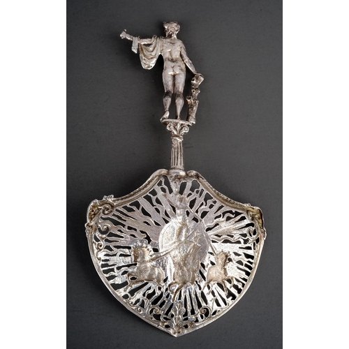 205 - A late Victorian silver ornate sifting spoon, the handle cast as Apollo standing on a plinth, the sp... 