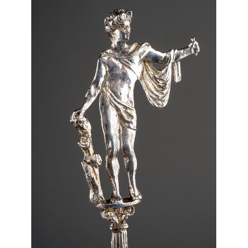 205 - A late Victorian silver ornate sifting spoon, the handle cast as Apollo standing on a plinth, the sp... 