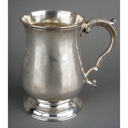 206 - A George III silver mug, baluster shaped engraved with initials, S-scroll handle with acanthus thumb... 