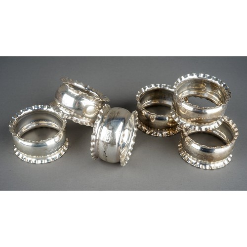 207 - A set of six Edwardian silver napkin rings with crimped borders, hallmarked by William Aitken, Birmi... 