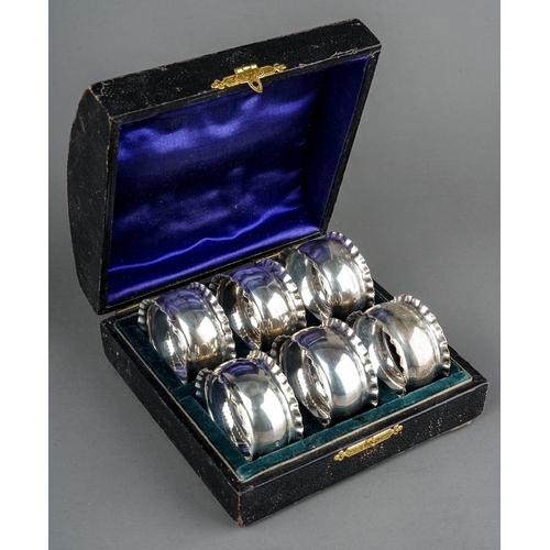 207 - A set of six Edwardian silver napkin rings with crimped borders, hallmarked by William Aitken, Birmi... 