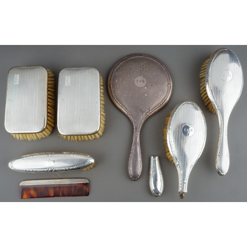 210 - A collection of early 20th Century silver mounted brushes and dressing table mirror, various dates a... 