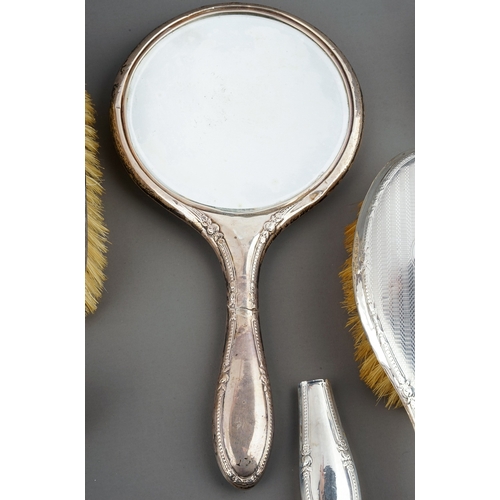 210 - A collection of early 20th Century silver mounted brushes and dressing table mirror, various dates a... 