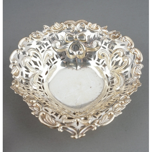 216 - A collection of late 19th/early 20th Century to include: bowl with crimped edges, heart shaped ring ... 