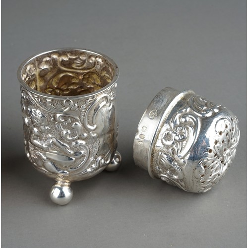 217 - A late Victorian silver pounce pot, the body chased with seated putti, one playing a drum, with scro... 