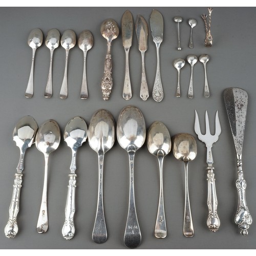 219 - A collection of silver flatware including Hanoverian table spoons, sugar nippers, teaspoons, butter ... 