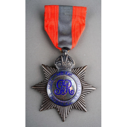 241 - A George V Pre-1920 Imperial Service Medal, white metal with blue enamel monogram and lettering, awa... 