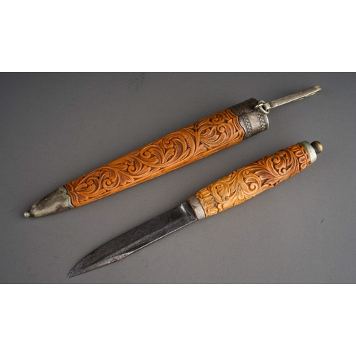 243 - Antique carved wooden Puukko knife and sheath.  Made by Magnus Hansen circa 1880.  Overall length in... 