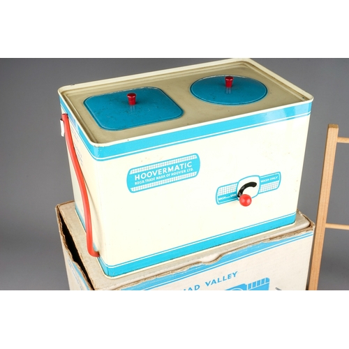 250 - A vintage boxed Chad Valley Hoovermatic washing machine and a vintage Toy ironing board, irons, buck... 