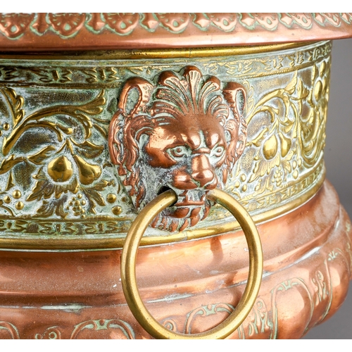 259 - A Middle Eastern brass and copper planter / jardiniere, chased with animals, flowers, foliage and la... 