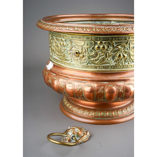 259 - A Middle Eastern brass and copper planter / jardiniere, chased with animals, flowers, foliage and la... 