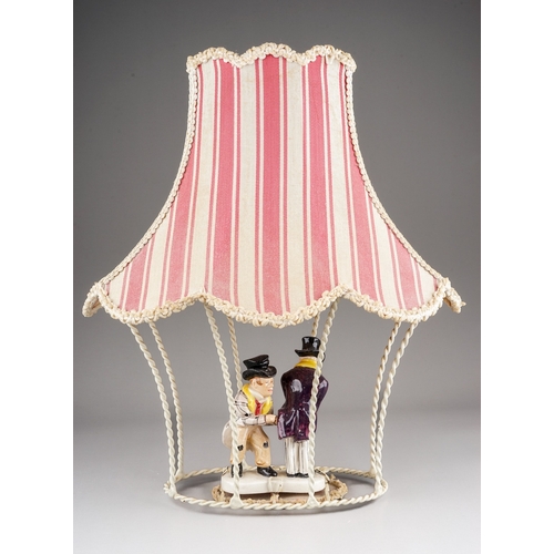 263 - A 20th Century decorative lamp shade with pink Regency stripe, the centre with ceramic figures of a ... 