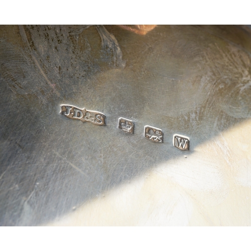 264 - A George VI silver pie crust waiter, plain centre on three scroll feet, hallmarked by James Dixon & ... 