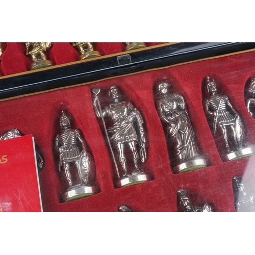 284 - Two Manopoulos gift chess sets cast as Greek-Roman warriors (silver and gold coloured) - 2 boxes