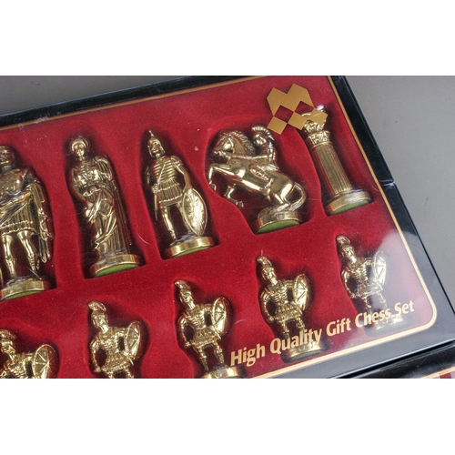 284 - Two Manopoulos gift chess sets cast as Greek-Roman warriors (silver and gold coloured) - 2 boxes