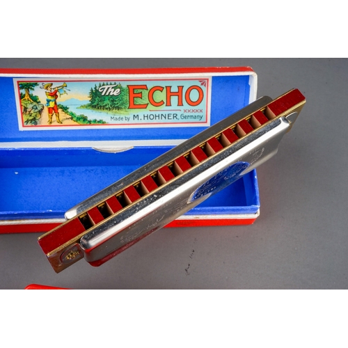 288 - A German boxed M Hohner Echo Vamper harmonica with Bell Metal Reeds and German The Bandmaster harmon... 