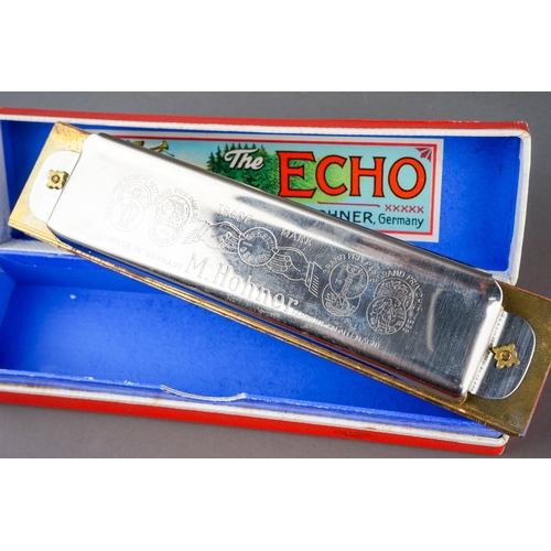 288 - A German boxed M Hohner Echo Vamper harmonica with Bell Metal Reeds and German The Bandmaster harmon... 