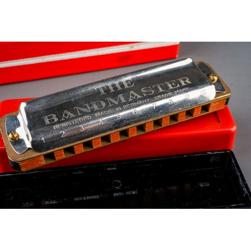 288 - A German boxed M Hohner Echo Vamper harmonica with Bell Metal Reeds and German The Bandmaster harmon... 