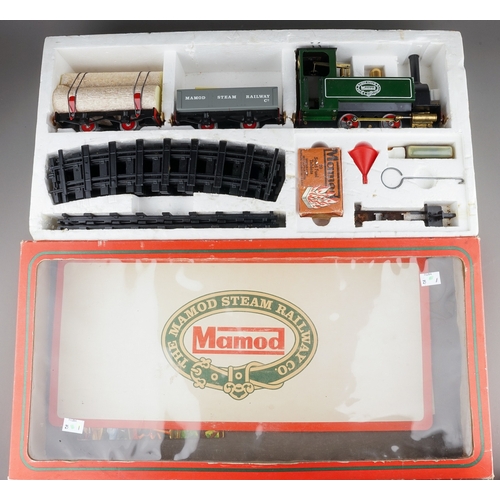 303 - A boxed The Mamod Live Steam Railway Company Goods Train Set comprising:  SL1 Tank locomotive, a red... 