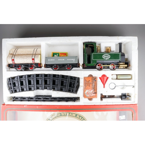 303 - A boxed The Mamod Live Steam Railway Company Goods Train Set comprising:  SL1 Tank locomotive, a red... 