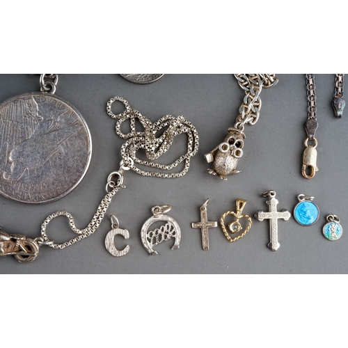 314 - A collection of silver and white metal jewellery, including chains, fobs, a curb-link bracelet set w... 