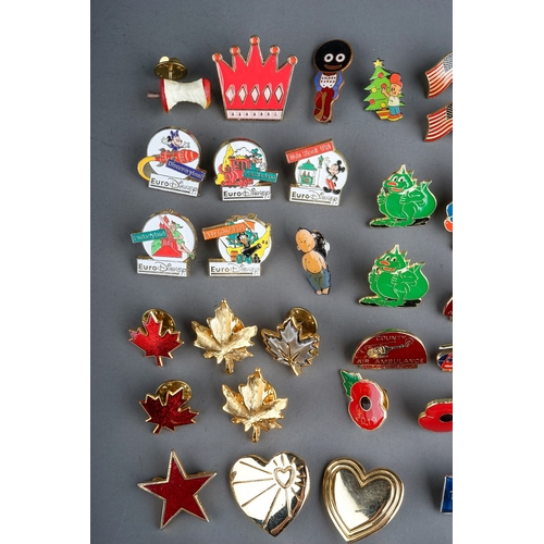 325 - A large collection of vintage and modern novelty metal and enamel lapel badges to include: Euro Disn... 