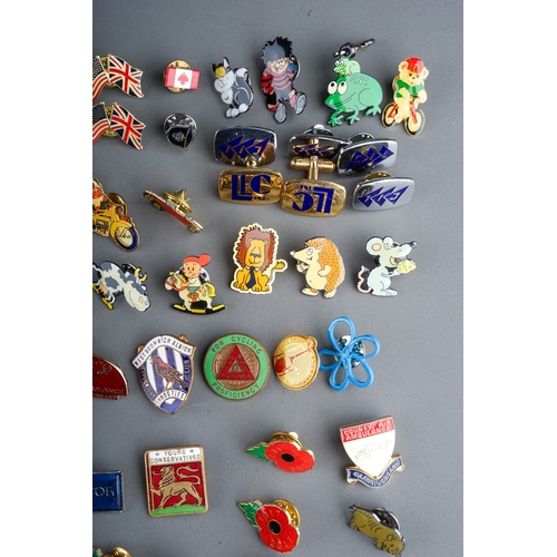 325 - A large collection of vintage and modern novelty metal and enamel lapel badges to include: Euro Disn... 