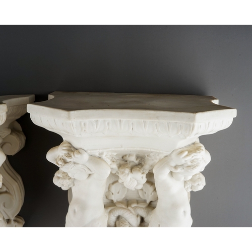 329 - A pair of Copeland Parian wall brackets, shaped tops above volute scrolls and putti with swags of fr... 