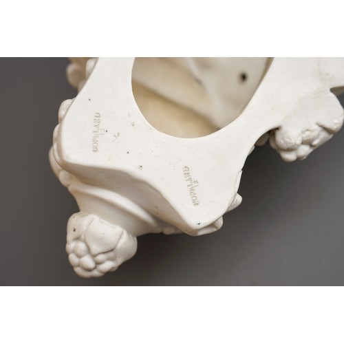 329 - A pair of Copeland Parian wall brackets, shaped tops above volute scrolls and putti with swags of fr... 