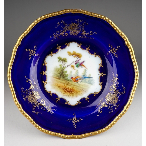 350 - A Coalport cabinet plate, scalloped gilt edge with cobalt blue border, the centre decorated with exo... 