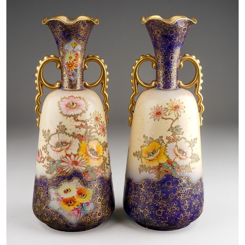 353 - A Pair of Carlton ware Wiltshaw & Robinson flared vases in the Anemone pattern. Flow blue to lower b... 