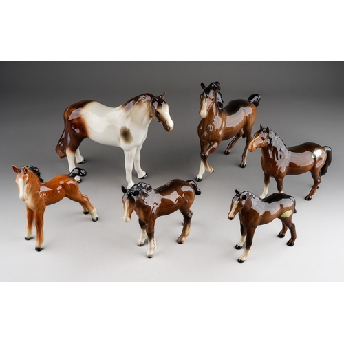 355 - A collection of ceramic horses to include: a Melba china skewbald and five various Beswick horses in... 