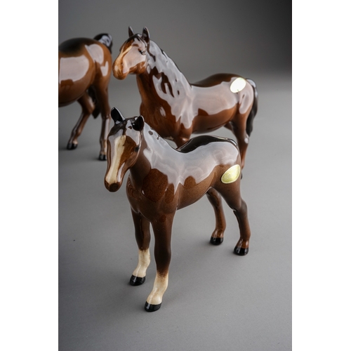 355 - A collection of ceramic horses to include: a Melba china skewbald and five various Beswick horses in... 