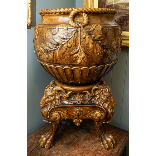 401 - A late Victorian Burmantofts monumental earthenware amber glazed jardiniere on stand, the large bowl...