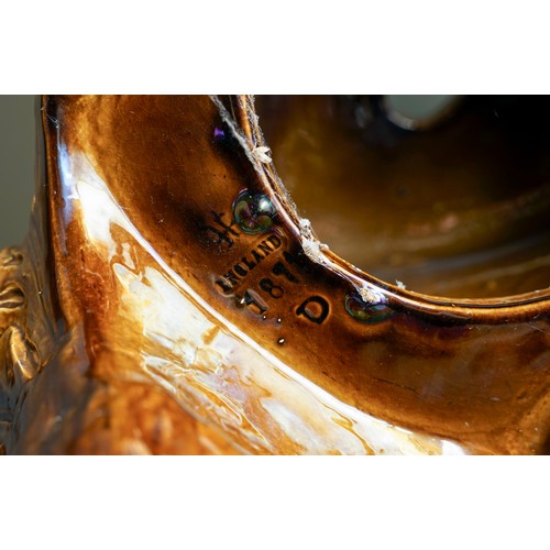 401 - A late Victorian Burmantofts monumental earthenware amber glazed jardiniere on stand, the large bowl... 