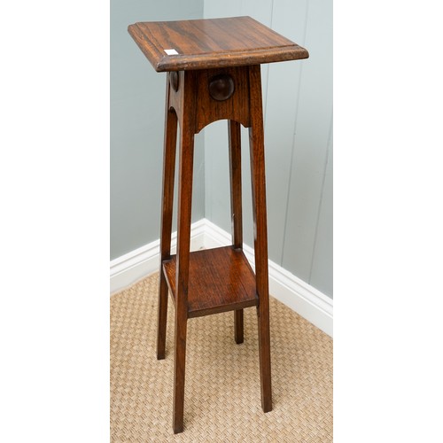 402 - An Arts & Crafts Liberty style oak jardiniere stand, plain body above tapering supports, the upper s... 