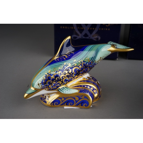 407 - Two Royal Crown Derby paperweights to include: Bottlenose Dolphin, gold stopper, red backstamp, date... 