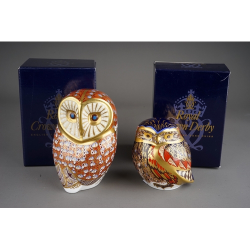 410 - Two Royal Crown Derby Owl paperweights, red backstamps, date codes, both with silver stoppers and bo... 