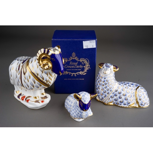 414 - Three Royal Crown Derby paperweights to include: large Ram, red backstamp, gold stopper together wit... 