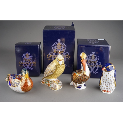 415 - Four Royal Crown Derby paperweights to include: Rockhopper Penguin, gold stopper, red backstamp, box... 