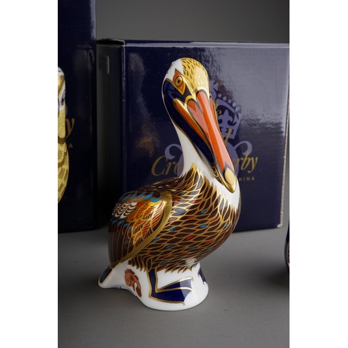 415 - Four Royal Crown Derby paperweights to include: Rockhopper Penguin, gold stopper, red backstamp, box... 