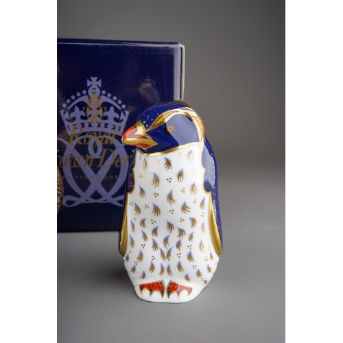 415 - Four Royal Crown Derby paperweights to include: Rockhopper Penguin, gold stopper, red backstamp, box... 